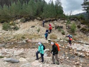 Walking retreat crossing river